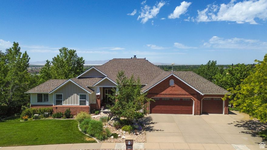 Gorgeous East Farmington home on the bench with Unbeatable Views and Thoughtful Upgrades. From the moment you enter this beautiful 4-bedroom, 3-bath home, you'll be captivated by soaring 18' ceilings, a striking see-through gas fireplace, and breathtaking mountain, lake, and sunset views that bring the outdoors in. The formal dining area seats up to 12 people with amazing views of Antelope Island. The primary bedroom is located on the main level and offers a peaceful retreat, complete with a cozy sitting area, remote-controlled fireplace, and walk-in closet. The luxurious en-suite bathroom provides spa-like comfort with premium finishes-heated tile floors, a Euro steam shower with a full glass surround and both rain head and handheld fixtures, a recirculating pump for instant hot water, a freestanding soaking tub, and an additional walk-in closet. Designed for entertaining, the walkout basement features 12' ceilings, a built-in bar, and a spacious open layout-perfect for gatherings. Step outside to your own backyard oasis with a covered patio, three custom Trex decks, a tranquil water feature, mature trees, and a fenced garden with producing peach trees. The yard is fully landscaped with an automatic sprinkler system, drip irrigation, and 100% perennials for easy, year-round beauty. Additional features include a dedicated main-floor office with French doors, three cozy gas fireplaces, remote-controlled insulated window coverings in the living and dining areas, a remote-control sunshade on the upper deck, a gas line on the front patio for a future fire pit, plenty of storage, daylight windows in the basement, a three-car garage, paid for solar panels that are fully transferable, a brand-new 4-ton A/C unit-plus lots more!  Located in a quiet East Farmington neighborhood near trails, schools, and convenient access to shopping, Farmington Station, Front Runner a plethora of restaurants, Highway 89, and I-15.