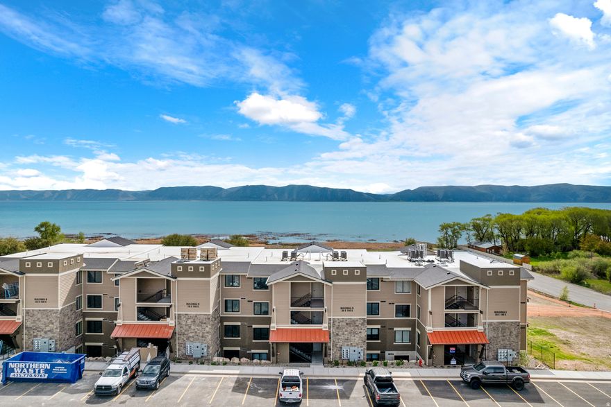 Brand new condo with beach access and stunning views of Bear Lake's turquoise waters! Ideally located in the heart of town, this beautifully designed 3-bedroom, 3-bathroom condo is just a short walk to the beach, restaurants, and shops. Enjoy soaring ceilings, a private covered balcony, and modern finishes throughout. Only 5 minutes from Bear Lake State Park Marina and 15 minutes from Beaver Mountain Resort-perfect for year-round recreation including boating in the summer and skiing in the winter. The unique lock-out floor plan offers flexible rental potential, allowing you to rent it as a 1, 2, or 3-bedroom unit, with separate kitchenettes in the additional bedrooms. Bear Lake is the ultimate destination for family fun and relaxation! Ask about our Lender incentives!
