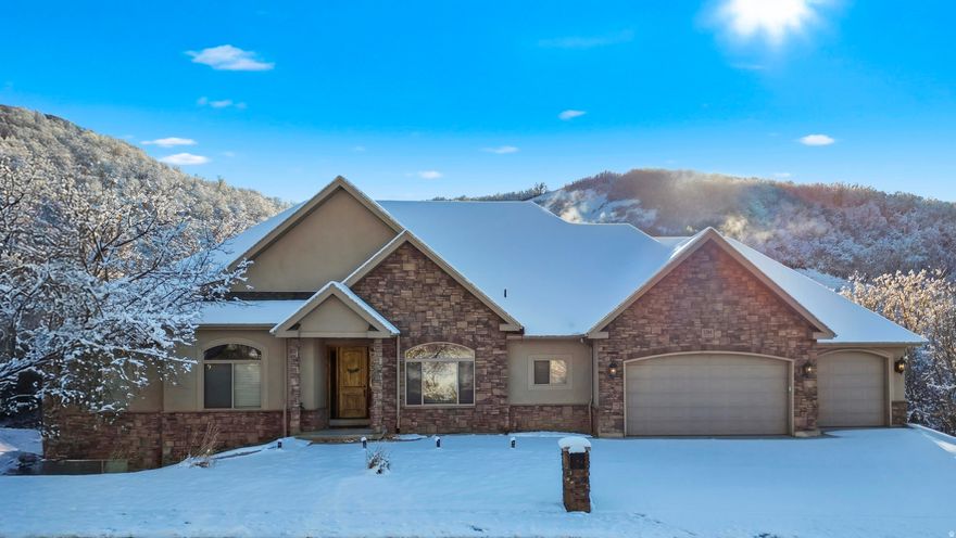 This amazing home is located minutes from Canyon Creek Drive Trailhead and downtown Bountiful. Enjoy a picturesque canyon scenery in your backyard hot tub or next to your fire pit listening to the relaxing sounds of the creek. Wait until you see the inside of this meticulously maintained custom built 6 bedroom/5 bathroom rambler. The open concept living room, dining room, and kitchen make the home feel spacious with plenty of natural light. The downstairs level comes with a beautiful second kitchen and a laundry. The lowest level includes approx. 1100 square feet of unfinished space below the garage. This room is about 20 feet high and perfect for all of your "toys". This still leaves 2260 square feet of finished living space in the lower level. New water heater and newer A/C.