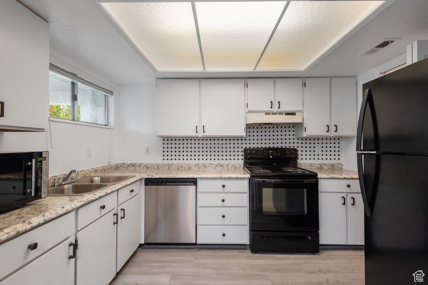 Seller offering 1/0 rate buydown with preferred lender - 5.34% first-year rate available. Contact agent for details. Experience convenient living in this top-floor condo near Redwood Road! This freshly painted 2-bedroom, 2-bathroom unit boasts new flooring and easy access to shopping, restaurants, and businesses. Enjoy the comfort of a well-maintained home with a new water heater 2019. Perfect for those seeking a vibrant lifestyle with everything at your doorstep! If square footage or acreage are of material concern to buyer, buyer is responsible to verify all to buyer's satisfaction.