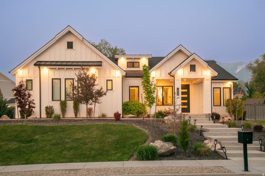 Gorgeous farmhouse with modern interior flare. The stunning curb appeal and presence of this home feels like a perfect home in every way. From the grand entrance and chandelier to the open concept living room and chefs kitchen this home is a 10. The kitchen has double wide fridge, extra fridge and wine fridge, gas stove and high end cabinets and countertops. The master bedroom is huge with a stone fireplace and on suite master bath with separate shower and soaking tub and extra large walk in closet. The home has plantation shutters throughout the main level and lots of light. The basement is fully finished with a kitchenette and gorgeous full bath downstairs. Garage is heated and home has a generator. Buyer to verify all info. Owner/Agent.