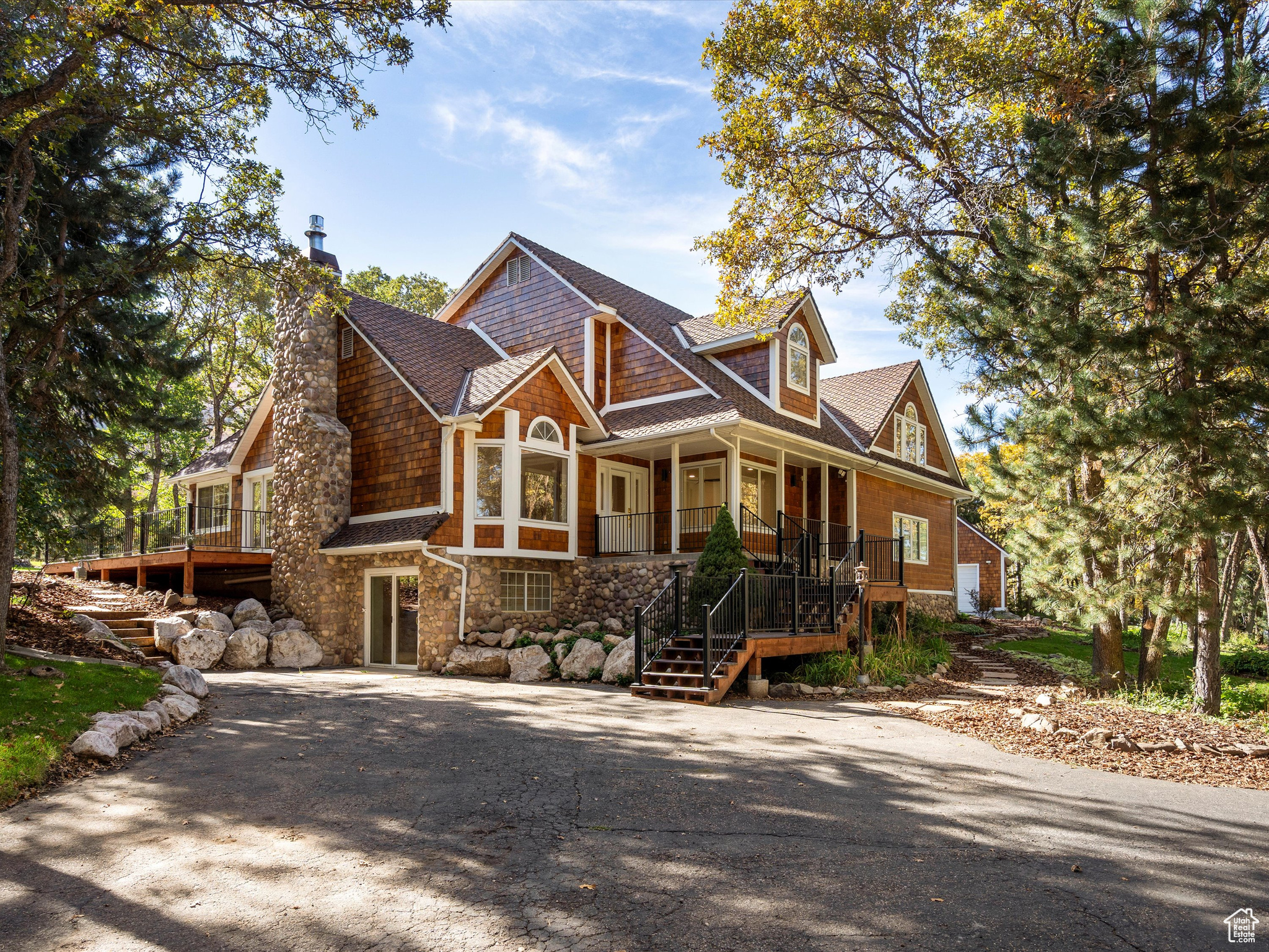 Discover a fully remodeled, whimsical escape, nestled on 1.5 acres in the heart of Eden, Utah. Blending the charm of an English cottage with luxurious modern upgrades, this 4,882 sq.ft. estate offers breathtaking panoramic views of Nordic Valley Ski Resort, right from your backyard. Boasting 5 spacious bedrooms and 5 beautifully updated bathrooms, this home is designed for comfort, entertainment, and ultimate mountain living. The ski-in/ski-out access to Nordic Valley Ski Resort makes it a dream for outdoor enthusiasts. Step outside to your own private oasis featuring a dedicated pickleball and basketball court, a large gazebo, and fully landscaped grounds designed for year-round enjoyment. Whether you're entertaining guests or simply soaking in the serene surroundings, this feels like a retreat! Optional adjacent buildable parcel is 1.05 acre (22-031-0005) and includes a 2-story 3,000sf barn, with an upper loft that is partially finished. This lot has its own private drive, and includes a natural spring well with 2 ponds. Perc test in progress. Square footage figures are provided as a courtesy estimate only and were obtained from county records. Buyer is advised to obtain an independent measurement.