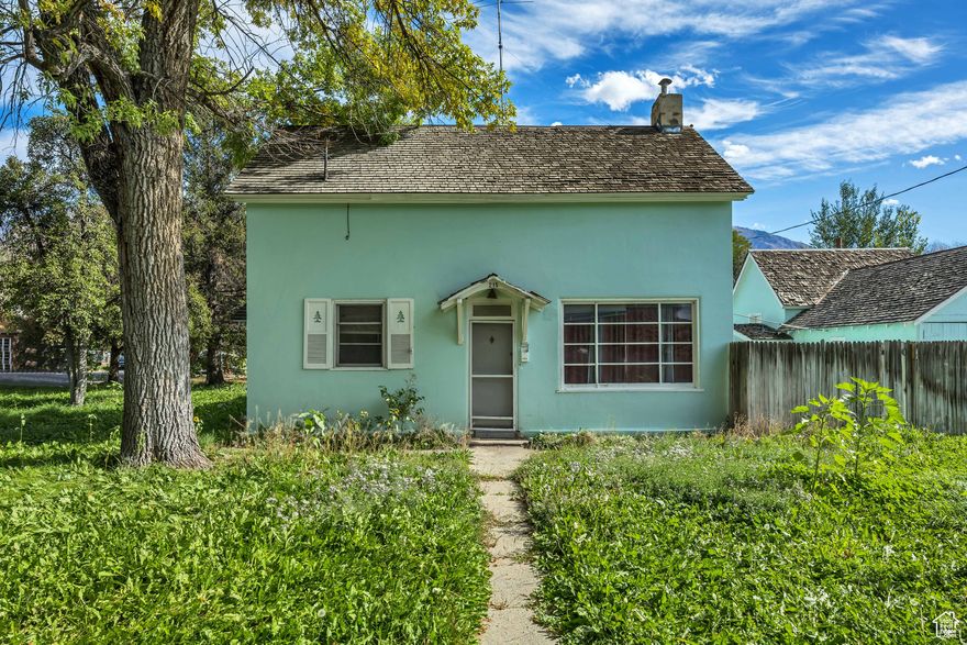 INVESTMENT OPPORTUNITY in the heart of Provo. This ideally-located duplex sits on a desirable corner lot with mature trees,  located within minutes of the BYU campus, making it ideal for long-term tenants or student rentals. Each unit offers comfortable living space with strong rental potential in a high-demand area, and the corner lot provides added privacy and flexibility with easy access to local schools, shopping, dining, and public transportation. The property also features a fenced backyard space, off-street parking, and a detached garage with a bonus room on the back, offering additional storage and versatility. Priced well below market comps, this duplex offers incredible potential for value add and sweat equity. Whether you're looking to expand your portfolio or secure a property in one of Utah County's strongest markets, this Provo duplex is a great investment opportunity.