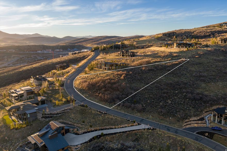 1.38-acre south-facing uphill lot in the gated Deer Vista community. Price Includes ARC-approved architectural plans valued at $80,000. Views of Jordanelle Reservoir and Deer Valley ski runs. HOA Fees: $320/month. 6 min to Deer Valley East Village, 12 min to Old Town Park City. Heber Valley Airport: 20 min | Salt Lake International Airport: 45 min