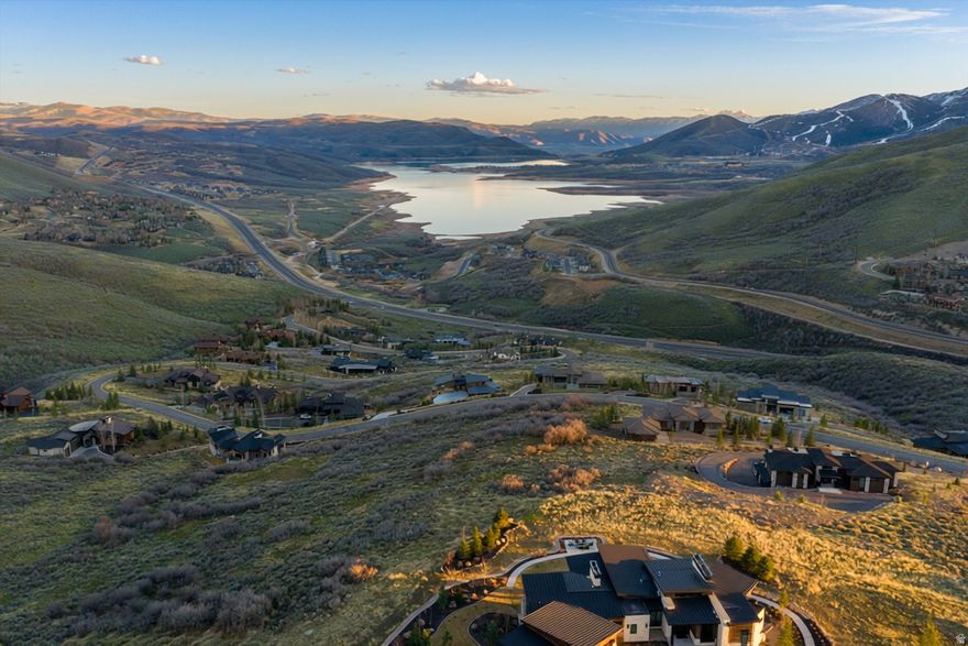 Deer Vista, where the mountains set the rules, the sky feels bigger than your plans and daily life bends around access to the outdoor playground! Sweeping panoramas of Jordanelle Reservoir and Deer Valley's ski runs unfurl from this rare 1.38-acre south-facing, uphill homesite in the gated enclave, where your home will sit elevated above its neighbors with unobstructed mountain and lake views from every window. Positioned in one of the most beautifully curated mountain neighborhoods in greater Park City - just 6 minutes to Deer Valley East Village and 12 minutes to Old Town - Lot 22 offers both the scale and the orientation that serious builders covet. With a gentle uphill pitch, the site allows you to command the ridgeline rather than follow it. ARC-approved architectural plans valued around $80,000 are included in the purchase price, to the buyer, offering a meaningful head start. Deer Vista's 103 custom homesites spread across 400 acres mean the density never intrudes, only the trails, the views, and the neighbors who chose this neighborhood for the same reasons you will. A community park, Black Rock Mountain Resort access, and a vibrant social calendar round out a lifestyle that is equal parts adventure and ease. This is the lot you build your forever home on, because there isn't another one like it. The Salt Lake International Airport is approximately 45 min away or fly in privately to the Heber Valley Airport which is 20 min away