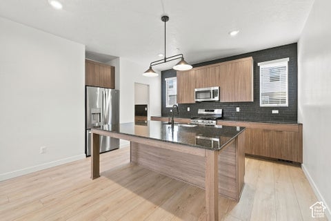 Photo of 2329 W MAGNOLIA LN #110, Roy, UT 84067 (MLS # 2193713)