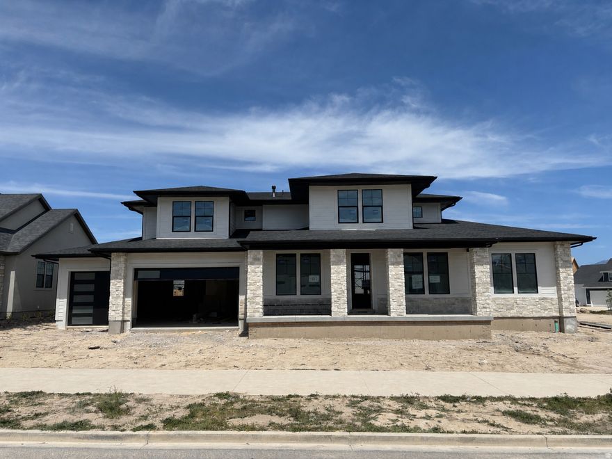 LOT#166 in Beacon Pointe by Symphony Homes. This stunning 'Browning XL' plan blends luxury with thoughtful design. Home is under construction and will be completed in July. Price includes full yard landscaping. Lots of upgrades and designer finishes throughout! The main floor features both a flex room (w/ French doors) and a formal living room with custom millwork and both have crown molding. Grand great room with two-story ceiling with wood beam grid ceiling. The gourmet kitchen will have quality appliances including a 48" ZLine 8-burner dual fuel range with double ovens, and a built-in refrigerator and freezer, a spacious butler's pantry, and a bright dining nook that opens to the covered patio. A custom mudroom bench and a large laundry room add everyday convenience. The expansive primary suite will have a decorative ceiling and includes a large custom-finished wardrobe room with a window. Primary bathroom will be a show-stopper with separated vanities plus a makeup counter, free-standing soaker tub, and 78x60 walk-in shower with a quartz bench. Upstairs has a loft open to below and a large bonus room. All bedrooms feature walk-in closets. The fully finished basement is built for entertaining with a media room, kitchenette, huge game room, and a gym with 3/4 bathroom (also accessed by adjacent bedroom). Garage will be finished to paint and 3rd stall is 38' deep and 18' wide in the back for potential to park capacity of 4 vehicles.  9' foundation walls, an active radon system, and a cold cellar. A must-see!