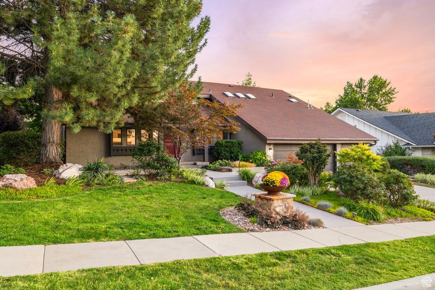 High on Salt Lake's East Bench between the world renowned Cottonwood Canyons and tucked into a beautiful and peaceful neighborhood sits this classic contemporary home. Vaulted ceilings, sky lights and large windows create light filled spaces. The tree lined property backs a quiet church allowing you to enjoy the beautiful mountain views from the new Trex deck or new stone patio. The open concept floor plan is flexible and flows easily up and down short flights of stairs. OVERSIZED 3 TRUCK GARAGE 31' x 27' x 8'... you won't find another garage like it!