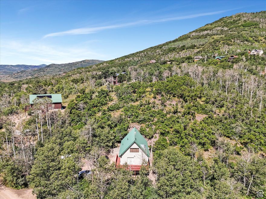 Charming recreational cabin in Aspen Mountain -perfect for a seasonal getaway! No year-round access, but fully move-in ready and sold furnished. Main level features 2 bedrooms with queen beds and a spacious 3/4 bath. Large loft upstairs with 2 additional beds and a convenient 1/2 bath. Attached garage offers direct access to the home and potential for extra living space. Sale includes all furniture, bedding, towels, and a fully stocked kitchen & patio furniture -just bring your personal items and enjoy! Square footage figures are provided as a courtesy estimate only and were obtained from builder.  Buyer is advised to obtain an independent measurement.