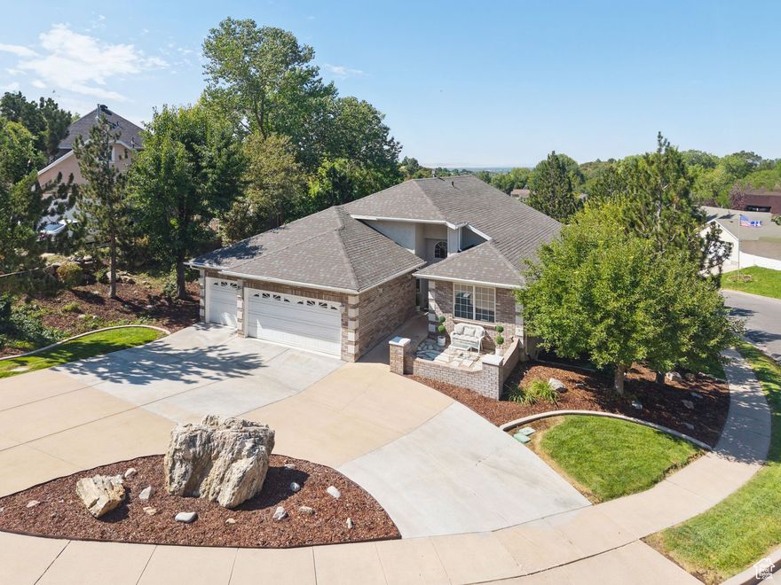 East Layton modern luxurious rambler remodeled in 2020! Step inside to be greeted by 15 foot vaulted ceilings that allow for an open, airy feel. The kitchen and baths shine with modern finishes, complemented by LifeProof LVP and carpet throughout. Never run out of space with walk in closets, an outdoor shed, and a large craft room. Enjoy outdoor entertaining with a massive deck upstairs, and covered patio outside the walk-out basement. This impressive package is complete with an epoxied garage floor, two water heaters, and a new roof as of 2020. Super convenient to Highway 89 and a myriad of outdoor activities.