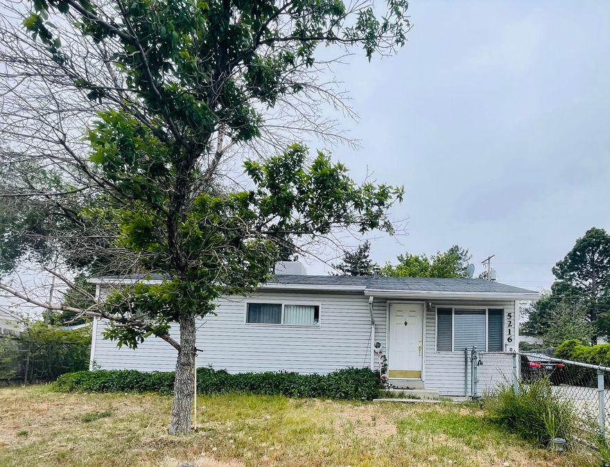 Single-story resedential home with light gray horizontal siding and dark shingle roof. The interior has hardwood flooring in the the bedrooms and living areas. The property includes a large concrete driveway (parking for 6-8 cars) witha metal carport and a fenced-in yard. Square footage figures are provided as a courtesy estimate only and were obtained from county records.  Buyer is advised to obtain an independent measurement. Please schdule your showing today!