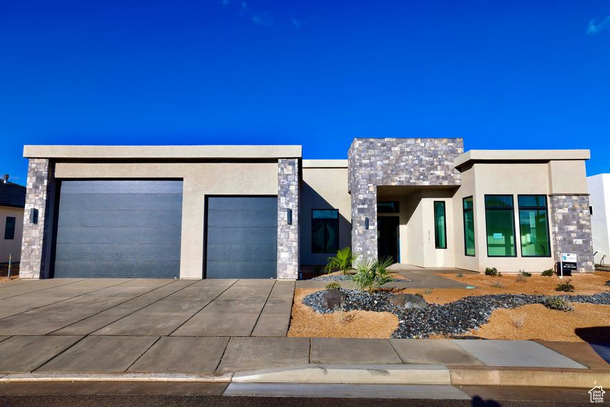 This rate is subject to change based on current market conditions.  Luxury Living at Hawkeye Point Experience the perfect blend of luxury and adventure at Hawkeye Point. Each home is designed with an open, elegant layout, a gourmet kitchen, and a sophisticated owner's suite with a spa-inspired bathroom. With 16-foot ceilings, the main living area feels grand and spacious.  This home offers:  4 spacious bedrooms  5 bathrooms  A private casita for guests or multi-generational living  A dedicated home office  Got toys? We've got space. This home includes an impressive 20' x 39' RV garage with a 16' x 12' door, perfect for vehicles, adventure gear, or a workshop. There's also a 12' x 24' single garage with plenty of room for a lifted truck.  Hawkeye Point is located in the scenic heart of Washington City, just minutes from downtown St. George, Tuacahn Center for the Arts, and outdoor destinations like Sand Hollow Reservoir and the Coral Pink Sand Dunes. Enjoy hiking, biking, water sports, off-roading, or a peaceful evening walk. This is the perfect place for an active lifestyle without sacrificing comfort or quality.