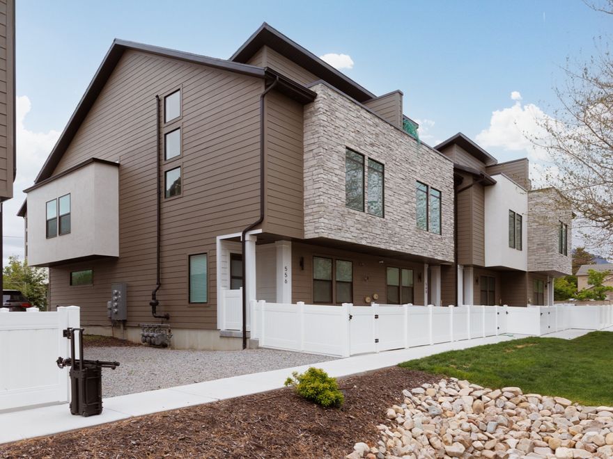 Luxury end-unit townhome in the highly desirable Fort Union area of Midvale, offering 4 bedrooms, 2 with en-suite baths, 3.5 bathrooms, a main-floor den, and an insulated 2-car garage. Thoughtfully designed with high-end finishes including quartz countertops, upgraded soft-close cabinetry, Signature Series appliances, and a brand-new Samsung Bespoke 4-Door refrigerator. Bathrooms feature designer tile surrounds and Euro glass shower doors, with custom window coverings throughout, dual HVAC systems, and a tankless water heater for efficiency and comfort. Flexible basement space can function as a 4th bedroom, second family room, or home office. Enjoy access to a community garden and direct proximity to Union Park, with easy walkability to local restaurants, shopping, and everyday conveniences. Ideal for those seeking low-maintenance living with quick access to I-215 and I-15, just minutes to Silicon Slopes, downtown Salt Lake City, and world-class skiing in Big Cottonwood Canyon and Little Cottonwood Canyon, including Brighton, Solitude, Alta, and Snowbird. Surrounded by mountain access, trail systems, and year-round outdoor recreation. Seller is including a one-of-a-kind Traeger Woodridge Pro/Elite grill from Traeger HQ.