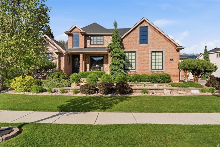 Immaculately maintained and exceptionally cared for, this stunning home showcases distinctive architecture and striking curb appeal that truly set it apart. Ideally situated in a highly desirable neighborhood with strong and rising property values, the location offers the perfect blend of beauty, convenience, and community. Residents enjoy close proximity to premier amenities, highly sought-after school boundaries, and a picturesque surrounding area featuring mature landscaping, scenic walking trails, and abundant open space.  Truly, look no further - this home has it all. A grand entrance welcomes you into an impressive great room featuring sweeping 18-foot coffered ceilings and exceptional craftsmanship throughout, including immaculate trim work, custom woodwork, railings, cabinetry, and designer finishes, highlighted by a striking fireplace.  The home flows into an inviting kitchen, dining, and family room, which create the perfect setting for entertaining guests or enjoying everyday living together.  The luxurious main-floor primary suite offers both comfort and elegance, complete with a separate soaker tub and shower, along with an expansive walk-in closet featuring custom organizers, built-in cabinetry, and a dedicated center island and makeup counter. Upstairs, you'll find three generously sized bedrooms plus a versatile bonus room ideal for a fourth bedroom, office, den, playroom, or additional entertainment space.  The fully finished basement provides yet another exceptional gathering area with a spacious family room, cozy fireplace, kitchenette, home gym, additional bedroom, and full bathroom - perfect for guests, multi-generational living, or entertaining.  Outside, the amenities continue with abundant parking, including an oversized RV pad large enough to accommodate all the toys. The backyard features a basketball court and an extraordinary outdoor living space designed for both relaxation and entertaining. Enjoy peaceful evenings around the built-in gas firepit, surrounded by mature trees, beautiful rockwork, and a thoughtfully designed patio area that blends style and comfort. A private veranda deck just off the primary suite adds another layer of tranquility and retreat-like living.  Additional highlights include an oversized garage, storage shed, and ample basement storage space. This remarkable property truly offers the complete package and presents better than new!  Don't miss this one!