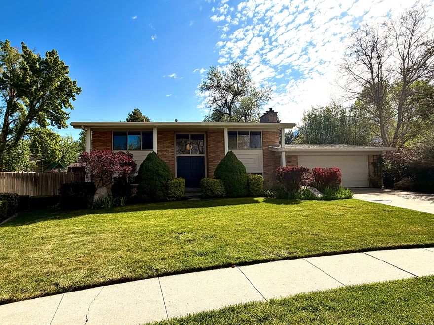 Tucked into one of Holladay's most established neighborhoods in the heart of the Salt Lake valley, this beautifully remodeled mid-century home (completely updated 2023) blends timeless design with modern livability. Every detail has been carefully considered, with updated plumbing, new electrical service, double-pane windows, and finishes throughout. Sunlight fills the main level, highlighting beautifully restored hardwood floors and a layout designed for both daily life and entertaining. The kitchen is the heart of the home, with quartz countertops, custom cabinetry with hidden storage, open shelving, induction stove, and a clean, modern design that makes both cooking and entertaining effortless. A dedicated laundry/mud room with backyard access keeps daily life organized. Downstairs, the bright basement with full-size windows feels like a natural extension of the home, not an afterthought. Four bedrooms feature double closets, storage is generous, and the flow works beautifully. Out back, the outdoor space shines. A deck off the dining area overlooks a large yard filled with mature trees, flowering perennials, berries, and an apple tree-creating a private, seasonal retreat. There's room to expand, with space for an ADU, pool, or RV parking without sacrificing the rest of the large, private lot. Set on a quiet street, yet a short walk or bike ride to Downtown Holladay. Harmons, Soho Food Park, local bakeries and cafs, plus parks, baseball fields, library, and local shopping. This location offers the best of both convenience and lifestyle. When the mountains call, you're minutes from world-class skiing, hiking, and biking. Information is deemed reliable, buyer to verify all. Listing agent has interest in property. Showing to start following Open House on 25APRIL at 2pm.