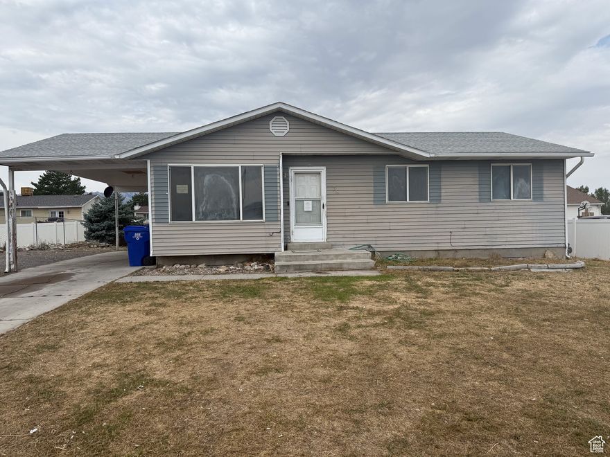 Investor Special. This Five Bedroom two bath Rambler with just under 2,000 sq ft has a good potential and is priced to sell. Great Floor Plan with Separate Basement Entrance for mother-in-law. Home has 2 kitchens and 2 laundry hookups. Located in a Great neighborhood just across the street from the rodeo grounds, the library, and police station. Home is also close to the Elementary, Jr. High, and High school as well as shopping, restaurants and main street.  Also includes spacious lot that is east facing. Home needs TLC and renovations throughout. Schedule your showing today! Square footage figures are provided as a courtesy estimate only and were obtained from tax data. Buyer is advised to obtain an independent measurement. See agent remarks for showing and offer instructions.