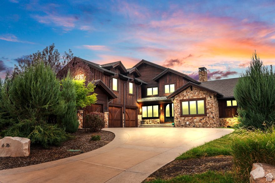 Luxury Golf Park Retreat in Red Ledges  Set on the scenic Golf Park in Red Ledges, this extraordinary residence blends refined mountain living with unmatched recreational amenities. Overlooking a tranquil pond along the fairway, the home captures sweeping views of Mount Timpanogos and the Wasatch Range, offering one of the community's most enviable settings.    Inside, vaulted ceilings, expansive windows, and timeless finishes frame the open-concept design. The chef's kitchen flows seamlessly into a spacious great room anchored by a stone fireplace, while the primary suite offers a private sanctuary with spa-inspired amenities and mountain-facing balconies. Step outside to an entertainer's dream. Expansive decks and patios overlook the pond and mountains, while a custom outdoor waterfall feature creates a serene ambiance. Two hot tubs-perfect for year-round relaxation-complement the home's resort-style outdoor living. A private sports court adds fun and functionality for all ages, while a heated driveway ensures effortless mountain living in every season. In addition to this remarkable property, Red Ledges residents enjoy access to world-class amenities including a Jack Nicklaus Signature Golf Course, private clubhouses, fitness and wellness centers, equestrian facilities, tennis and pickleball courts, pools, and year-round lifestyle programming. This home also offers the rare opportunity for a full golf membership, placing every amenity of Red Ledges at your fingertips