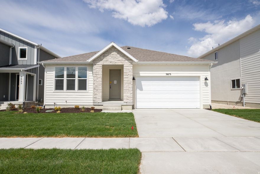 INTEREST RATES STARTING AS LOW AS 4.99% with our preferred lender or AMAZING $15,000 INCENTIVE TOWARDS CLOSING COSTS, RATE BUYDOWN, OR PRICE REDUCTION REGARDLESS OF LENDER! (Talk to agent for conditions). Must-see Harmony Community in Eagle Mountain! Move-in ready! This beautiful home built by Flagship Homes features 3 bedrooms, 2 bathrooms, quartz slab countertops, painted cabinets, laminate flooring on the main level, vaulted ceilings on the entire main level, landscaped front yard and 2 car garage. The backyard can be landscaped for an additional charge. The primary bedroom has a vaulted ceiling, large walk-in closet, and dual sinks with a separate tub/shower. With an unfinished basement, this home provides space for storage and room to grow. (If preferred, basement can be finished for an additional charge.) Call for more information or stop by our model home at 656 E. Nathan Street, Eagle Mountain for a tour. Model home hours: Monday-Saturday 11 AM - 6 PM. Buyers to verify all information. Square footage is from house plans.