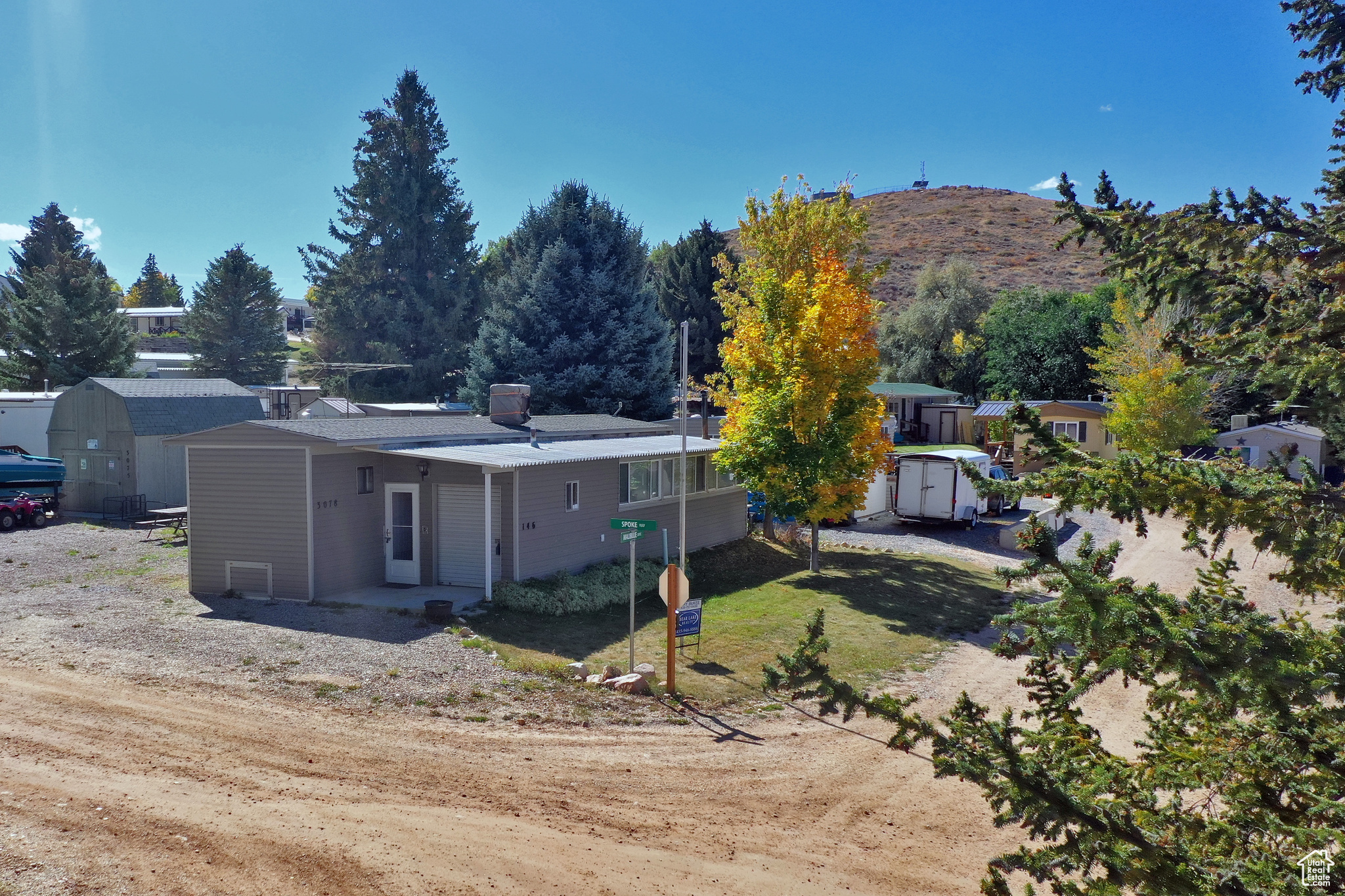 If you are looking for that perfect getaway spot for peace and quiet, you won't want to miss this beautiful mobile home with an additional lot. This area has something for everyone-whether you want to relax, fish, hike, stargaze, jet ski, wakeboard or simply explore the beauty of the area. Located close to the emerald waters of Bear Lake, Utah. This home is perfect for adventure seekers as well as those looking for a peaceful retreat. Includes a home on 1 lot and a spacious 14x20 foot shed with loft and a large fire pit on the second lot. The home has 2 bedrooms 1 full bathroom and a fully enclosed patio with large windows. Plenty of space to park the whole family. This is truly a gem- don't miss your chance to own a slice of paradise. Separate purchase of lots considered.