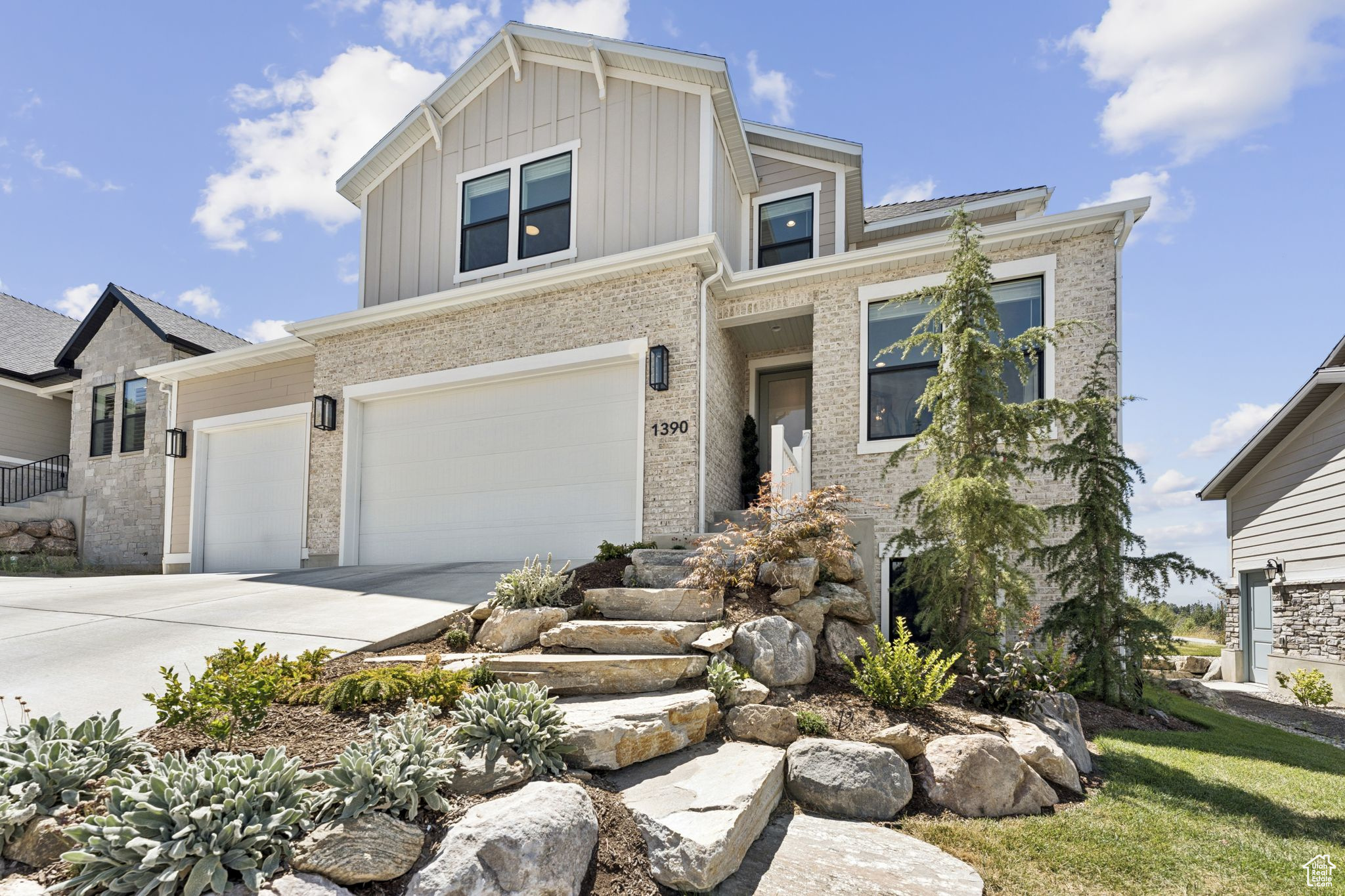 Located in the coveted east bench enclave of Orchard Ridge Estates, this exclusive setting offers a perfect blend of privacy, prestige, and breathtaking lake and mountain views. Surrounded by new development and custom homes, 1390 E. Orchard Ridge Lane is a stunning two-story home with four spacious bedrooms, three well appointed bathrooms. A luxury home built with the top Ivory Home designer package. Situated on a fully landscaped and fully fenced lot that offers private outdoor space to entertain. The first thing you'll notice in this home is its open interior that is bathed in natural light streaming through oversized and perfectly placed windows. As you walk through the tall eight foot doors throughout the home, you'll find elegant flooring and tile. A home that offers great flow and energy! Beautiful wainscotting and board and batten accents adorn the front entry, foyer and office areas. Host unforgettable gatherings or unwind in comfort in the spacious dining and living areas, centered around a warm and inviting gas fireplace. The flow and ambiance between spaces creates an ideal setting for entertaining or quiet evenings at home. Thoughtfully located on the main level, the primary suite provides both luxury and ease of access. Complete with a spa-like en suite with Tori tub, designer tile detailing and accents, black matte hardware, and a Euro-style shower surround. The heart of the home is a chef's dream kitchen, equipped with full-height quartz backsplash, quartz countertops, magnificent island, stainless steel double ovens, gas cooktop, elegant maple cabinets with soft tone under-lighting and a huge pantry. The large loft upstairs provides another open adaptive living space with two additional spacious bedrooms and full bath offering beautiful design selections. The unfinished basement with towering 9-foot basement foundation walls provide wonderful extra space and flexibility, perfect for multi-generational living or guests. The three car garage includes enlarged bay doors and side door access for convenience to the backyard. Convenient access to 89, Bonneville Shoreline Trail and Adams Canyon Trailhead. Square footage figures are provided as a courtesy estimate only and were obtained from county records . Buyer is advised to obtain an independent measurement and to verify all.