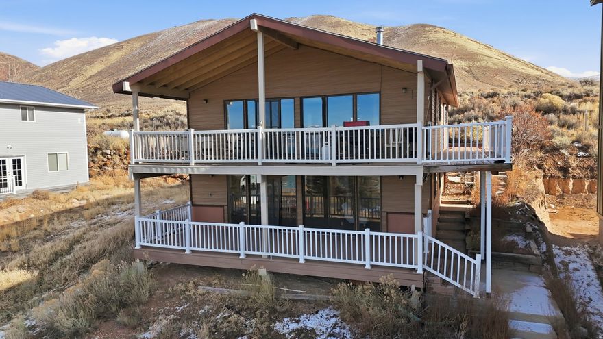 Welcome to your Bear Lake retreat in the coveted East Shore Subdivision of Saint Charles, Idaho! This awesome getaway offers the perfect blend of recreation, comfort, and year-round living. Enjoy a gated community with incredible HOA amenities including pickleball courts, biking and hiking trails, and a semi-private beach with easy access to East Shore Marina for effortless boat and watercraft docking. All of this for a low $75/month HOA fee! The home features 4 bedrooms and 2 bathrooms with brand-new LVP flooring throughout, creating a fresh, clean, and modern feel. Cozy up by the wood-burning fireplace after a day on the lake, and enjoy the convenience of having the washer, dryer, refrigerator, microwave, and wood stove all included. Step outside to two covered deck spaces, perfect for outdoor dining, picnics, or simply soaking up the Bear Lake sunshine. Whether you're looking for a peaceful vacation escape, an investment property, or a full-time residence, this home delivers. Bear Lake is a year-round playground offering boating, hiking, biking, pickleball, and endless outdoor adventure. This is your chance to own the perfect retreat in one of the most desirable communities on the east shore! Buyer to verify all Information