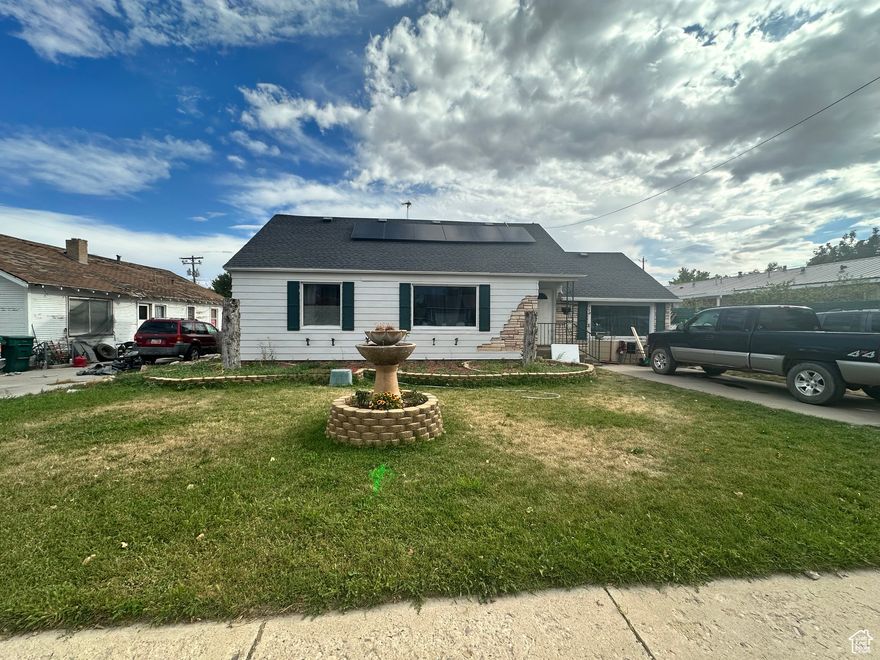 Located in the Heart of Vernal! This beautiful home is minutes from schools, churches, restaurants, retail stores and grocery stores! 4 Bedrooms, 2 bathrooms with just under 1,700 sq ft!  It also has .23 of an Acre which includes an amazing greenhouse, shed and mature fruit trees. If you have a green thumb or wish to have one, this house is for you! Solar panels have been recently added. Buyer must be able to assume the loan on them.   Square footage figures are provided as a courtesy estimate only. Buyer is advised to obtain an independent measurement.