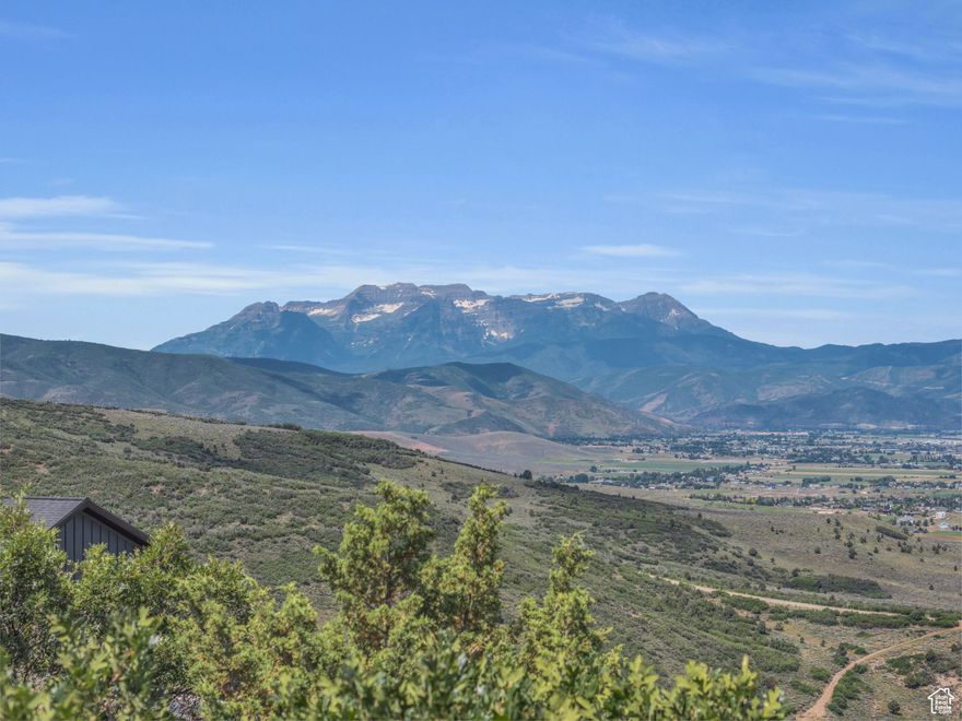 If you've been hunting for the perfect lot for your future family legacy mountain home, then look no further. This gently sloped uphill lot features unobstructed 180 degree views of Timpanogos, the top of Snowbird, and the entire Heber Valley. Water, power, and high speed internet are available and a four bedroom septic system was just approved by the county for this property, saving you money and time in designing your mountain home. This lot is located within Timberlakes, a private gated neighborhood with year round road access, several common areas with ponds and hiking trails, and access to spectacular snowmobiling in the High Uinta Mountains.