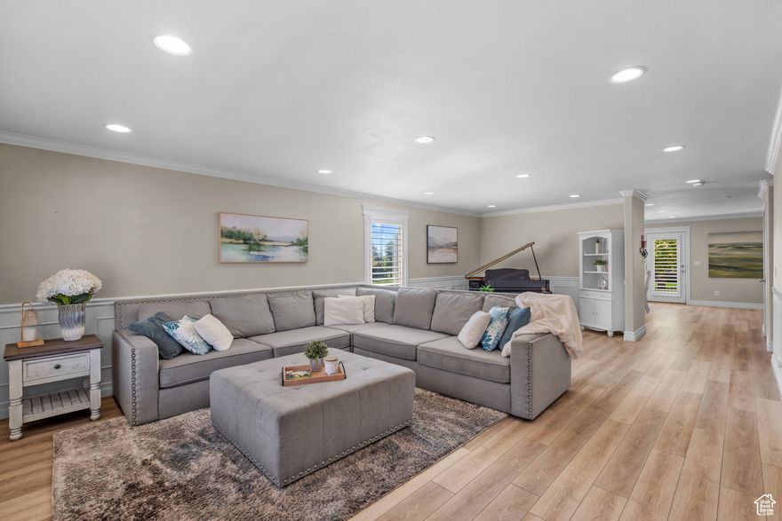 Price improvement !! This beautifully updated home features a spacious chef's kitchen with a 10-foot island, quartzite countertops, walk-in pantry, double ovens, two dishwashers, and a large fridge/freezer!  The functional layout includes a dedicated office/homework space and convenient dual laundry hookups-plus 2 sets of washers and dryers are included! The expansive primary suite offers two walk-in closets and a luxurious en-suite bathroom.  The primary bath has a wet room (three shower heads & a freestanding tub), dual sinks, makeup station, and radiant heating. Each bedroom includes its own walk-in closet! The plantation shutters and crown molding throughout the home are just the icing on the cake!  Enjoy beautifully landscaped grounds and breathtaking mountain views -all just minutes from American Fork Canyon. This home will make all your wildest dreams come true. - Napoleon Dynamite