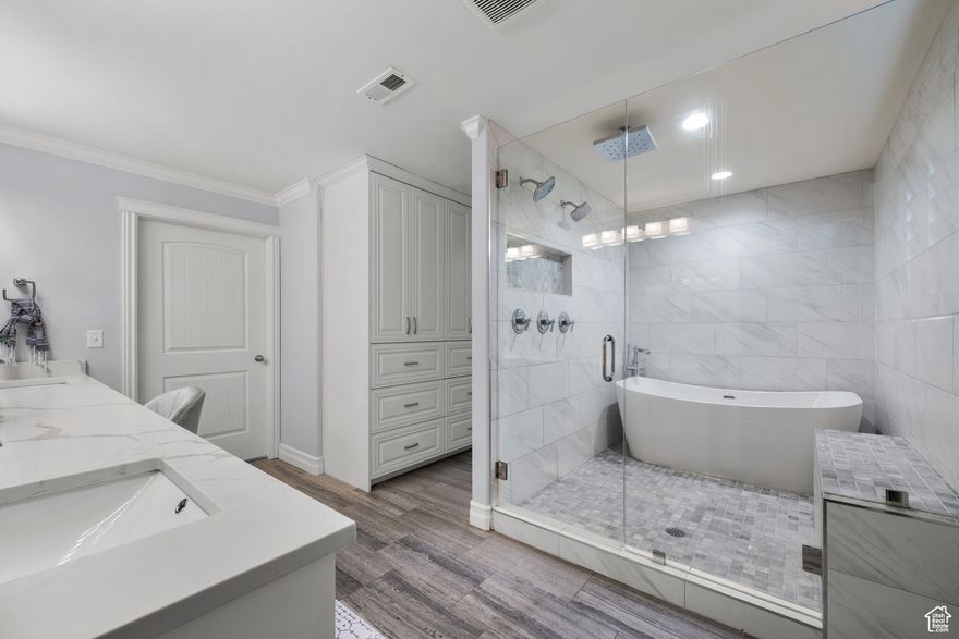 Price improvement !! This beautifully updated home features a spacious chef's kitchen with a 10-foot island, quartzite countertops, walk-in pantry, double ovens, two dishwashers, and a large fridge/freezer!  The functional layout includes a dedicated office/homework space and convenient dual laundry hookups-plus 2 sets of washers and dryers are included! The expansive primary suite offers two walk-in closets and a luxurious en-suite bathroom.  The primary bath has a wet room (three shower heads & a freestanding tub), dual sinks, makeup station, and radiant heating. Each bedroom includes its own walk-in closet! The plantation shutters and crown molding throughout the home are just the icing on the cake!  Enjoy beautifully landscaped grounds and breathtaking mountain views -all just minutes from American Fork Canyon. This home will make all your wildest dreams come true. - Napoleon Dynamite