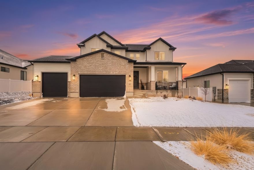 Welcome to this thoughtfully designed Herriman home offering space, function, and a clean aesthetic ready for personalization. The open main level features a bright living area that flows into a well-appointed chef's kitchen with modern finishes, quality appliances, and ample prep space.  With 6 bedrooms, 3.5 bathrooms, den space, 3+ car garage and a fully plumbed workshop, the layout provides flexible options for guests, work, or hobbies. The primary suite offers a comfortable, private retreat, while the fully finished basement adds a spacious second living area.  Additional features include a full irrigation system and a radon mitigation system already installed. Balanced design and generous square footage create a home that adapts easily to a variety of living needs.