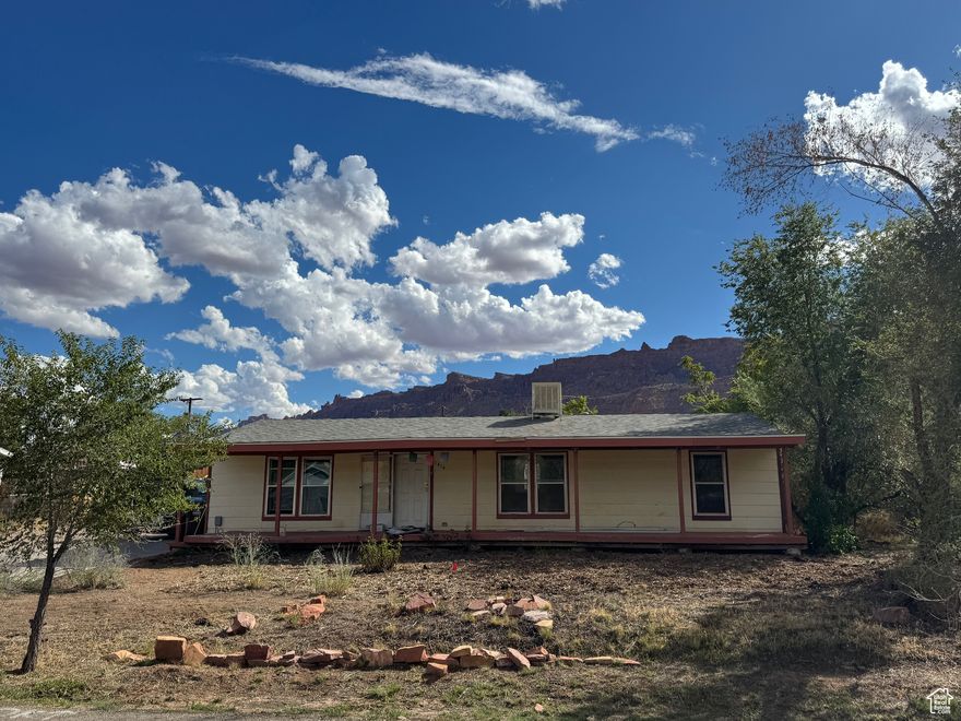 Charming Manufactured Home with Red Rock Views  This beautifully updated 3-bedroom, 2-bath manufactured home offers comfort, style, and an unbeatable location. Featuring a newer roof, brand-new floors, an updated kitchen, and refreshed bathrooms, the home is move-in ready with thoughtful updates continuing throughout the listing period.  Enjoy stunning red rock views from your own backyard, complete with a covered area and fire pit-perfect for gatherings year-round. The covered front porch provides a welcoming spot to relax, while the spacious yard makes outdoor living easy.  Located in a friendly neighborhood just minutes from downtown and steps from the bike path, this property is an excellent starter home or investment. Priced to sell, it combines modern updates with unbeatable value.    Square footage figures are provided as a courtesy estimate only and were obtained from GRAND COUNTY tax records .  Buyer is advised to obtain an independent measurement.