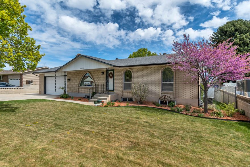 OPEN HOUSE SATURDAY, April 11 - 12:00-2:00 pm. Beautifully updated full brick rambler featuring thoughtful upgrades and timeless charm! Remodeled kitchen w/white cabinetry extended to the ceiling, stainless steel hardware, elegant quartz countertops, and newer refrigerator and range. Brand new carpet and pad throughout, along with calming paint tones. The main floor offers 3 bedrooms, including a remodeled primary bathroom and convenient main floor laundry. The basement boasts a HUGE family room-perfect for parties and gatherings-plus 2 additional bedrooms, a 3/4 bath, and plenty of storage space. Step outside to an easy-to-maintain backyard w/added privacy and a covered deck. Unlike many newer homes, this home  features a longer and wider garage along with RV parking.