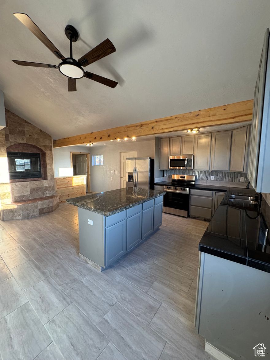 Beautifully renovated and move-in ready!! This stunning 4 bedroom home offers stylish updates and thoughtful craftsmanship throughout. From the warm wood accents to the custom tile that flows through the kitchen and bathrooms, every detail shines. The magnificent primary suite feels like a retreat complete with fireplace, walkout deck, walk-in shower and jetted tub. With laundry on the main level, instantaneous hot water heater, freshly shingled roof and an extra lot included, it's as practical as it is beautiful. This one is special and the only thing missing is it's new owner.  Call today for your personal tour. Square footage figures are provided as a courtesy estimate only. Buyer is advised to obtain an independent measurement.