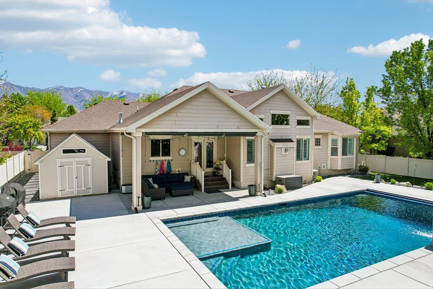 A rare blend of brightness, meticulous care, and resort style living awaits in this stunning West Kaysville home. This impeccably maintained home is located in a highly desirable neighborhood on a quiet street with wonderful neighbors. Bright, open floor plan features extra tall and vaulted ceilings, refinished hardwood floors, new carpet (2022), white plantation shutters, and abundant natural light throughout-pride of ownership is evident in every detail. The kitchen is ideal for entertaining with granite countertops, double ovens, a gas cooktop, and all new appliances included. Six bedrooms total, with three on the main level and three in the basement, plus an unfinished gym room. The main level features two secondary bedrooms, 1.5 baths, and a spacious primary suite; while the basement offers an oversized family room, play space, three bedrooms, and a full bath. Enjoy the backyard oasis completed in 2024, featuring a heated saltwater 9' deep Gunite pool with LED lighting, new landscaping, sprinkler system with drip irrigation, covered patio, fenced yard, and new 10x12 shed. Additional upgrades include a tankless water heater and new A/C. Close to trails, parks, rail trail, shopping, dining, exceptional schools, and easy access to I-15, Hwy 177, and Hwy 89. Truly move in ready.