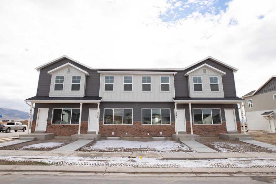 AMAZING $10,000 INCENTIVE towards closing costs, rate buydown, or price reduction regardless of lender! Plus, this home qualifies for Utah's First-Time Homebuyer Program-giving you up to AN ADDITIONAL $20,000 for down payment, closing costs, or interest rate buydown! Must-see Harmony Community in Eagle Mountain! This beautiful townhome built by Flagship Homes features 9' ceilings on all 3 floors, 3 bedrooms, 3 bathrooms, a finished basement, quartz slab countertops, painted cabinets, laminate flooring on the main level, 1 car garage, and full landscaping. The primary bedroom has a large walk-in closet with dual sinks in the primary bathroom. This townhome is move-in ready. Call for more information or stop by our model home at 3859 N. Thomas St., Eagle Mountain for a tour. Model home hours: Monday-Saturday 11 AM - 6 PM. Buyers to verify all information. Square footage is from house plans.