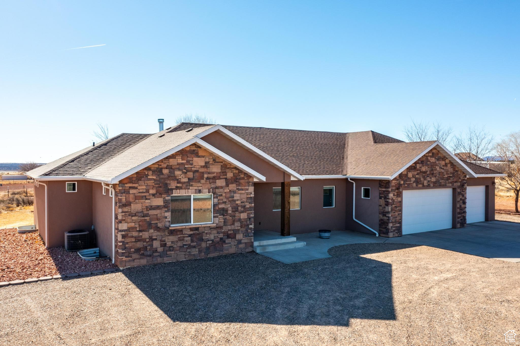 This rare and meticulously crafted ICF (insulated concrete forms) home sits on 2.52 acres of horse property in the desirable Kanab Creek Ranchos subdivision, offering stunning Red Rock and Kaibab views from a peaceful corner lot. Inside, enjoy the warmth of hardwood floors and a custom wood-burning fireplace. The main level features a spacious primary suite with a large walk-in closet and modern bath, an additional bedroom, full bath, and an office with built-in shelving. The open-concept great room and kitchen have soaring ceilings, a dining banquet, and a granite kitchen island for extra seating. An oversized butler's pantry offers ample storage space, with room for large appliances. A separate laundry room completes the first floor. Downstairs, find an expansive gaming or billiard room, three extra-large bedrooms (one with its own ensuite). A large safe room offers added security for your valuables. An additional exercise room which adds even more versatility. The 4-bay garage with pull-through access provides easy entry to the fully landscaped backyard, which includes mature trees and a south-facing covered patio. Large 2-car steel-framed detached shop with power. Make this exceptional home and property your next dream escape! Buyer to verify all.