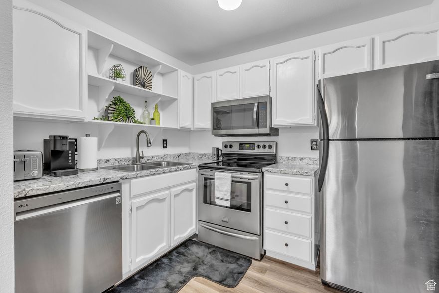 Step inside this Instant Equity Condo, and enjoy the fresh updates, including modern flooring, countertops, appliances, and a newer HVAC system. The kitchen comes complete with stainless steel appliances, making it move-in ready.  This bright and open home features a spacious layout, plenty of natural light from large windows, and a private balcony perfect for relaxing. You'll also appreciate the convenience of two parking spaces (one covered, #61), plus a storage shed for your extras. A great condo in a fantastic location, this condo checks all the boxes. Buyer to verify all information, including square footage.