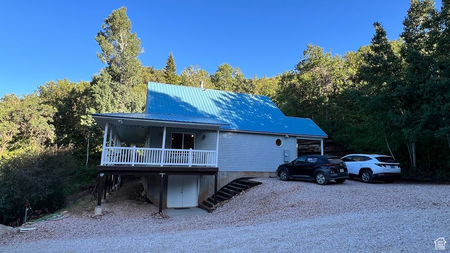 This home is in a gated community, you will need to be accompanied by your agent or contact the listing agent to gain entry to the property. Enjoy the peace and solitude this fully furnished and equipped mountain home offers. Wildlife and beautiful views are everywhere, you will love being at the top of the hill looking out over the trees from the wrap around covered deck. This private getaway offers a BBQ grill that is plumbed into the home propane system, a large firepit, covered patio and deck, and fantastic storage area for your toys. The basement is unfinished and has double doors that will allow most side by sides, 4 wheelers, snowmobiles, and small utility trailers to be stored inside away from the elements. Another unique and valuable feature of the basement is the 1/2 bath. The water system can be shut off/activated in multiple zones, that means you can use the cabin in the winter without having to winterize the entire water system when you do. You will save thousands because this fantastic property is being sold with all of the furnishings, artwork, and most of the tools and equipment, so you are ready to enjoy this amazing property on day one. Stairs and retaining wall have been added for convenience and reduced maintenance.