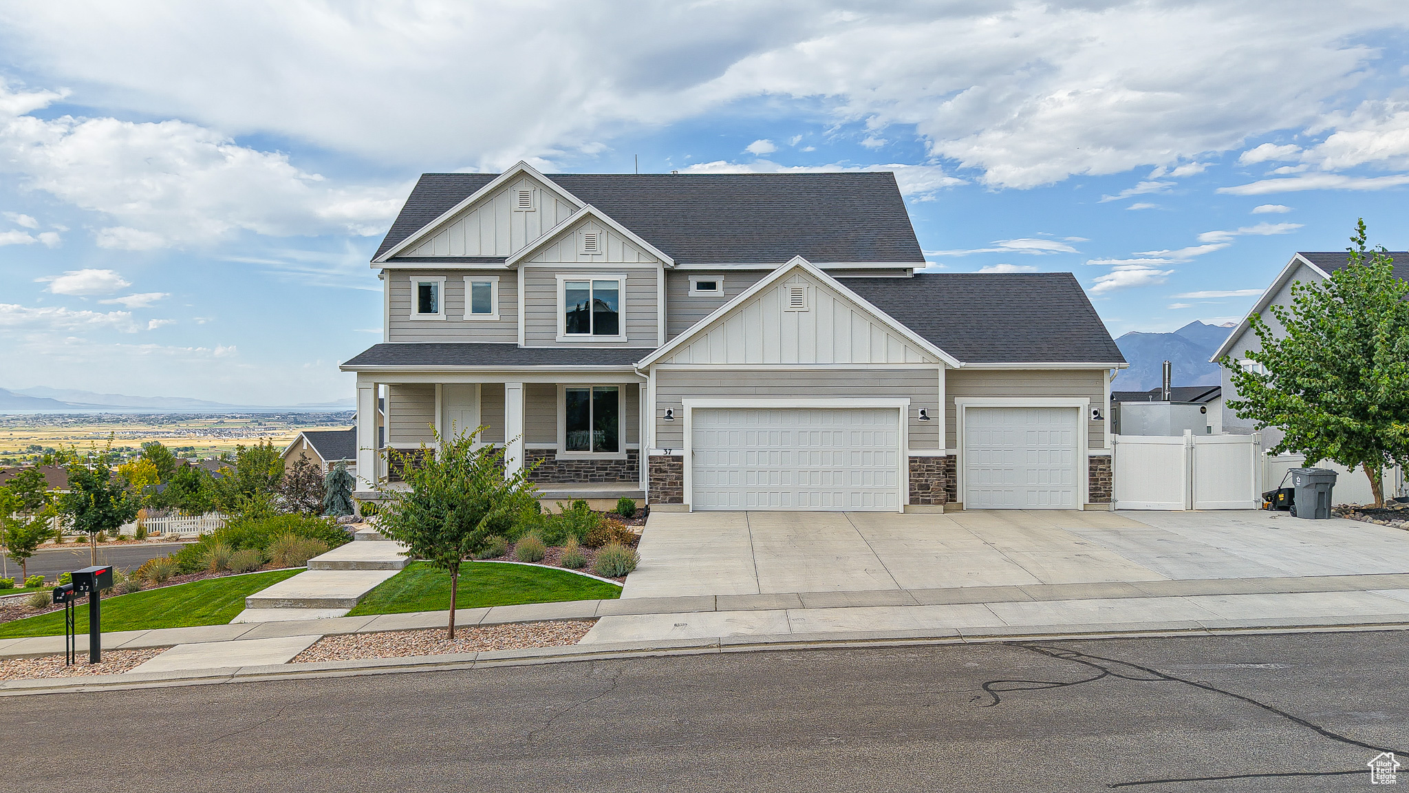 OPEN HOUSE 9/6 11-1 *Be sure to click the tour button for the virtual tour! Welcome to your new home in the heart of Elk Ridge where incredible views and comfortable living come together in the perfect family setting. From every window, you'll enjoy breathtaking scenery-majestic mountain peaks, the peaceful shimmer of the lake and twinkling city lights at night. Inside, the open floor plan is designed with family in mind. Whether you're cooking in the fabulous kitchen, helping with homework or relaxing together in the bright, airy living room, this home makes it easy to stay connected. The modern kitchen has plenty of counter space, beautiful tile back splash an appliance garage, a large pantry and room to entertain! The main floor boasts 9' ceilings, updated lighting throughout and thoughtful upgrades to the kitchen. With dual furnaces, A/C units and water heaters, you'll be sure to stay comfortable all year long! Enjoy the benefits of a brand new water softening system to protect your appliances and plumbing and make maintenance of your home a breeze. Step outside to the spacious backyard which includes a play set, trampoline, fire pit and plenty of room to roam! Interested in extra income or space for extended family members? This incredible home includes a 2 bedroom ADU with it's own separate entrance and driveway! Also included in this impressive home is room to park toys or an RV. Located in a quiet, family friendly community with fresh mountain air and room to grow this Elk Ridge gem offers a lifestyle that's as practical as it is picturesque.