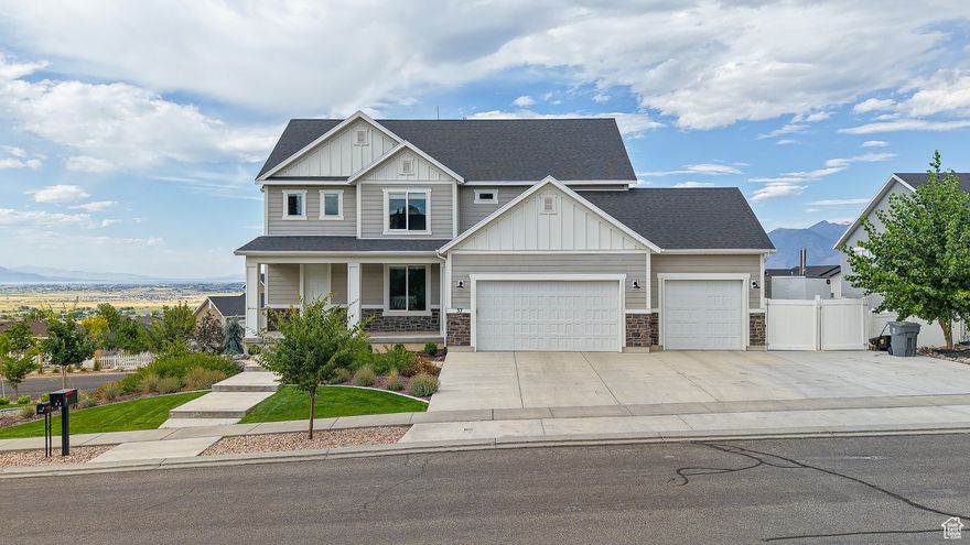 OPEN HOUSE 9/6 11-1 *Be sure to click the tour button for the virtual tour! Welcome to your new home in the heart of Elk Ridge where incredible views and comfortable living come together in the perfect family setting. From every window, you'll enjoy breathtaking scenery-majestic mountain peaks, the peaceful shimmer of the lake and twinkling city lights at night. Inside, the open floor plan is designed with family in mind. Whether you're cooking in the fabulous kitchen, helping with homework or relaxing together in the bright, airy living room, this home makes it easy to stay connected. The modern kitchen has plenty of counter space, beautiful tile back splash an appliance garage, a large pantry and room to entertain!  The main floor boasts 9' ceilings, updated lighting throughout and thoughtful upgrades to the kitchen. With dual furnaces, A/C units and water heaters, you'll be sure to stay comfortable all year long! Enjoy the benefits of a brand new water softening system to protect your appliances and plumbing and make maintenance of your home a breeze. Step outside to the spacious backyard which includes a play set, trampoline, fire pit and plenty of room to roam! Interested in extra income or space for extended family members? This incredible home includes a 2 bedroom ADU with it's own separate entrance and driveway! Also included in this impressive home is room to park toys or an RV. Located in a quiet, family friendly community with fresh mountain air and room to grow this Elk Ridge gem offers a lifestyle that's as practical as it is picturesque.