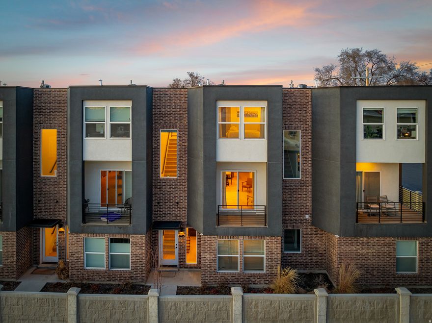 Experience modern urban living in this beautifully designed 3-bedroom, 3-bath townhome located in one of Salt Lake City's most up-and-coming, walkable neighborhoods. Offering 1,698 square feet of contemporary style, this home features an open-concept layout where the kitchen, dining, and living areas flow seamlessly-perfect for entertaining or everyday living-while expansive windows flood the space with an abundance of natural light. The sleek, modern design carries throughout, complemented by the convenience of a two-car garage and all appliances included. As an added bonus, the seller is willing to include all interior furnishings, creating a truly turnkey opportunity. Just steps from local dining, coffee shops, and city amenities and minutes from downtown, this home delivers effortless living, modern comfort, and unbeatable lifestyle appeal. Square footage figures are provided as a courtesy estimate only and were obtained from County Records. Buyer is advised to obtain an independent measurement.