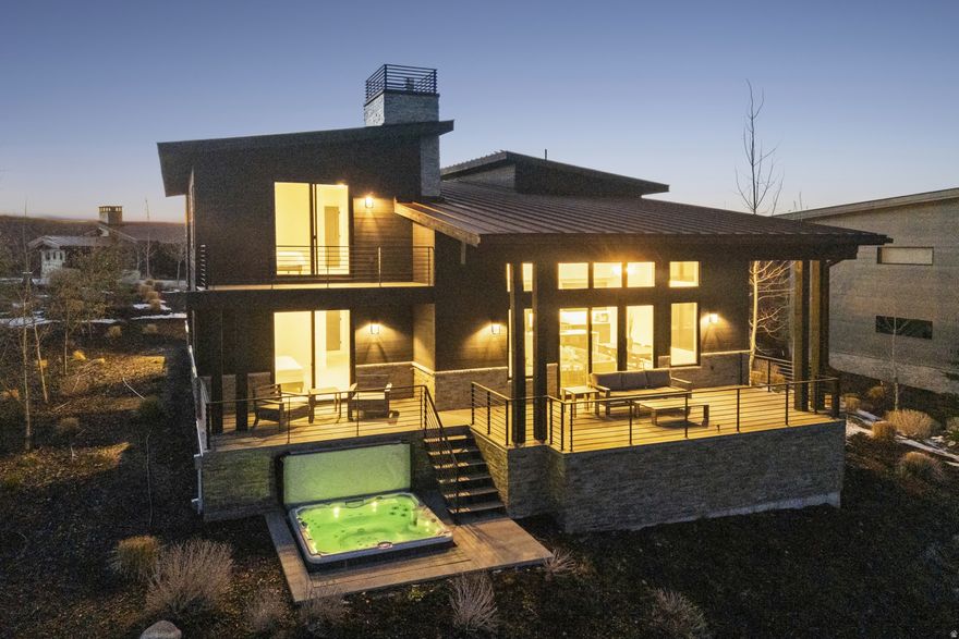 Contemporary Promontory Villa -- Wake up to sunrise views over the 7th green and end your evenings soaking under the stars-this mountain modern villa is all about living well. Perched above the Painted Valley Course, this beautifully designed 3-bedroom retreat blends clean lines with warm, inviting spaces. Two private primary suites make hosting effortless, while the open-concept great room flows seamlessly from kitchen to dining to living-perfect for gathering with friends and family. Walls of glass bring the outdoors in, leading to expansive patios made for entertaining or simply unwinding. With radiant heat, Viking appliances, a private hot tub, and offered fully furnished, this is luxury made easy. Just bring your suitcase and start enjoying the Promontory lifestyle.