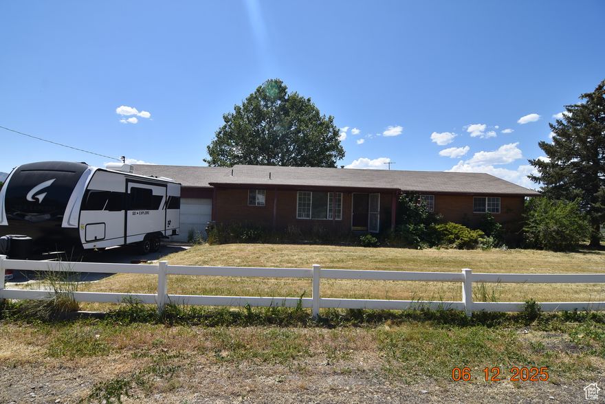 Don't let this property slip through your fingers.  41.24 acres made up of two parcels (24:010:0005 & 24:019:0014) with 57 Shares of Lakeshore irrigation.  Hay currently being grown and harvested.  There is a 3 bedroom, 1.75 bath brick rambler home the property.  Newer laminate flooring, gas forced-air furnace with central air, gas water heater, living room, family room, kitchen.  Owner's bedroom has a private 3/4 bathroom.    Square footage figures are provided as a courtesy estimate only and were obtained from Utah County records. Buyer is advised to obtain independent measurements and verify all information to their satisfaction. Wheel lines and farm equipment are not included.