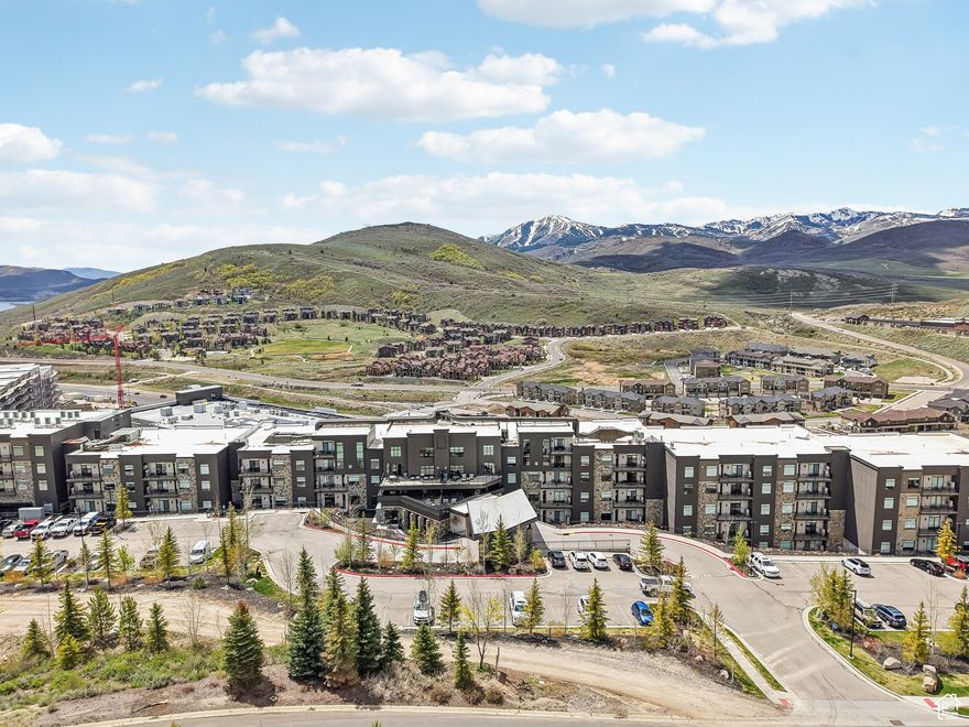 This beautifully furnished 2-bedroom residence at Black Rock Mountain Resort offers a perfect mountain escape with panoramic views of the Wasatch Range, Park City, and Jordanelle Reservoir. Located on the 5th floor, this turnkey unit features a private balcony, lock-off layout for rental flexibility, in-unit washer and dryer, and high-end Bertazzoni appliances.  Enjoy easy access to Deer Valley East Village and Park City-just 10 minutes away-with an on-demand shuttle service. Resort amenities include a year-round heated pool, hot tub, steam room, sauna, fitness center, members' lounge, market, restaurant, and bar.  Coming soon: Ice Hockey Rink & Event Center (opening November), plus plans for a second pool, Topgolf simulator, and additional dining options.