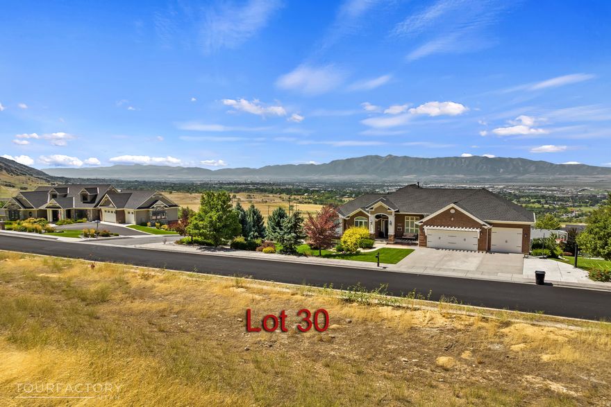 Stunning Half-Acre Lot with Mountain Backdrop & Valley Views  No HOA! Welcome to your dream homesite! Nestled against the majestic mountains with sweeping views of beautiful Cache Valley, this half-acre lot offers the perfect blend of natural beauty, privacy, and opportunity. Whether you're looking to build your forever home or create a private mountain retreat, this lot delivers.  The adjacent half-acre lot is also available for purchase, giving you the flexibility to expand your vision-build a larger custom home, add a detached garage or guesthouse, or design your dream backyard oasis with a pool and extensive landscaping. With no HOA restrictions, you have the freedom to create the space you've always imagined.  Don't miss this rare chance to own a piece of paradise with unbeatable views, peaceful surroundings, and endless possibilities. GEO tech test required by the city have been completed.