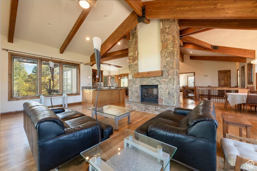 Welcome to Luxury, Comfort and Convenience in this Meticulously constructed Stone and Stucco estate  featuring great room concept with soaring vaulted ceilings, Chef's kitchen.  Spa- inspired Primary Suite with Fireplace, jetted tub, steam shower and private balcony. 3 additional bedrooms, 2 Offices, 4 bathrooms, gym, and a Family room. Granite Counter Tops. Hardwood, Slate and carpet floor coverings. Elevator, heated driveway, 3-car oversized heated garage. Pella triple pane windows. Beautiful private yard with expansive views. This home blends timeless elegance with modern amenities perfect for discerning buyers seeking luxury, privacy, and comfort.