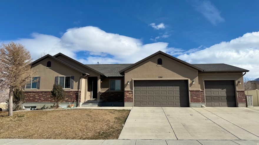Welcome to this gorgeous house in Tooele! Boasting 3,553 square feet of living space , this 5-bedroom, 3-bathroom home has exactly what you've been looking for. The inviting main floor features a spacious kitchen, an office, a great room, and the convenience of a mud room and main floor laundry. Retreat to the large main bedroom, designed to be your personal sanctuary.  Downstairs, you will find a fully finished basement with an enormous family room, plus an additional bedroom and bathroom. Enjoy beautiful evenings on the open patio overlooking a gorgeous, fully landscaped backyard. Situated on a 0.26-acre corner lot , this home offers breathtaking lake and mountain views. It also includes a 3-car attached garage.