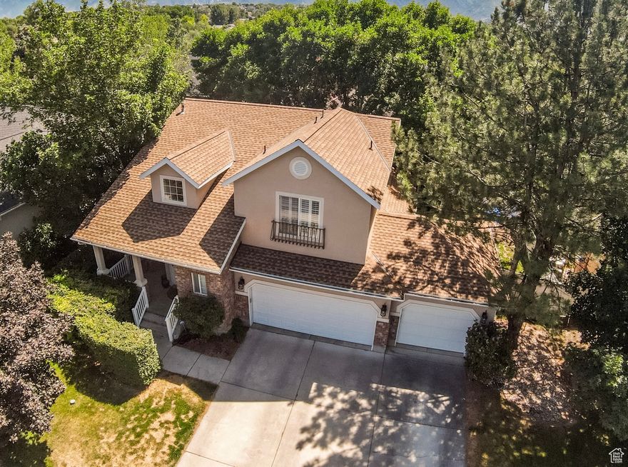 Tucked away on a quiet, private loop in the sought-after Sunset Ponds community, this beautifully remodeled Draper home offers the perfect blend of modern design, warmth, and livability. With its fresh updates, soaring vaulted ceilings, and abundant natural light, every detail has been thoughtfully curated for both style and function.  The heart of the home is the updated kitchen, remodeled in 2020 with knotty alder cabinetry, granite countertops, a custom stone backsplash, and stainless steel appliances. The adjoining family room features a cozy gas fireplace framed by built-ins, while the formal living room provides additional gathering space. Step out from the kitchen onto a large deck, where mountain views create the perfect backdrop for entertaining or simply enjoying a quiet evening.  Upstairs, the primary suite is a true retreat with vaulted ceilings, an ensuite bath, and breathtaking views of Lone Peak. Two additional bedrooms share a Jack & Jill bath, offering both convenience and privacy. The fully finished lower level expands the living space with a second family room, built-in Murphy bed, a striking gas fireplace with custom stonework, plus a bedroom and full bath-ideal for guests or multi-generational living.  The private backyard is fully fenced and surrounded by mature trees, while the rare heated and cooled 3-car garage (one of only three in Sunset Ponds) adds flexibility and value-and is already wired with a 220 outlet for EV charging. Recent upgrades include brand-new paint throughout, a new roof (2023), and a 95% efficiency furnace.  Sunset Ponds offers a lifestyle as exceptional as the home itself, with access to a community pool, pickleball court, playground, fishing pond, and scenic walking trails. Just a short walk to the TRAX station and minutes from ski resorts, shopping, bike trails, and Corner Canyon schools, this location is truly unmatched.  Seller will consider all offers, including potential seller financing-call agent for details.