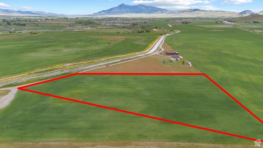 Nestled between the stunning Bear River Valley to the west and rolling mountains to the east, this 5.5-acre parcel offers a rare opportunity to own a piece of Northern Utah's breathtaking countryside. Located on a quiet private drive just minutes from the freeway, this property provides the perfect blend of rural serenity and convenient access. Whether you're envisioning a country-style event center, party barn, agricultural project, or future homestead, this land holds limitless potential. The wide-open space and panoramic views create an ideal setting for gatherings, weddings, or simply enjoying the peaceful surroundings. Eligible for Greenbelt status to keep annual property taxes extremely low. Stubbed with power and ready for electrical hookup. An approved well permit is included.  Septic and propane are needed, which is typical for rural areas. This private location is just a few miles from I-15. Currently not approved as a residential building lot, but development is possible for buyers willing to work with the county to secure the required roadway easements with a neighboring farmer. Whether you're looking to build, invest, or create a unique gathering space, this scenic parcel offers space, freedom, and possibilities. Address is approximate. Buyer to verify all information.