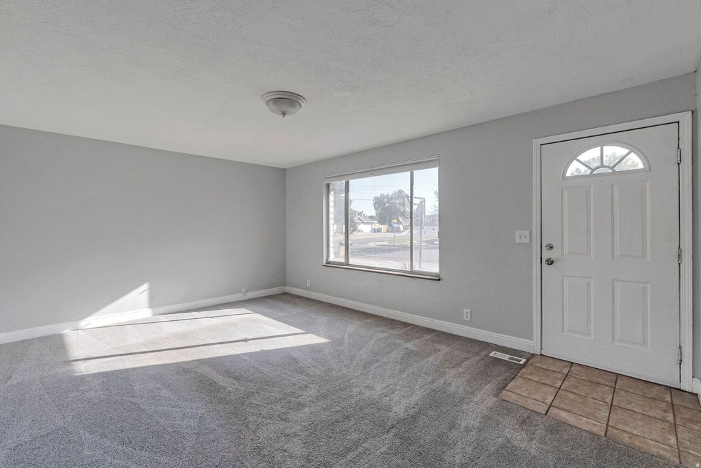 Photo of 3246 W ROYALWOOD DR, Taylorsville, UT 84129 (MLS # 2143169)